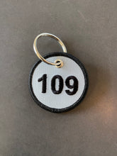 Round 109 Embroidered Keyring - Grey