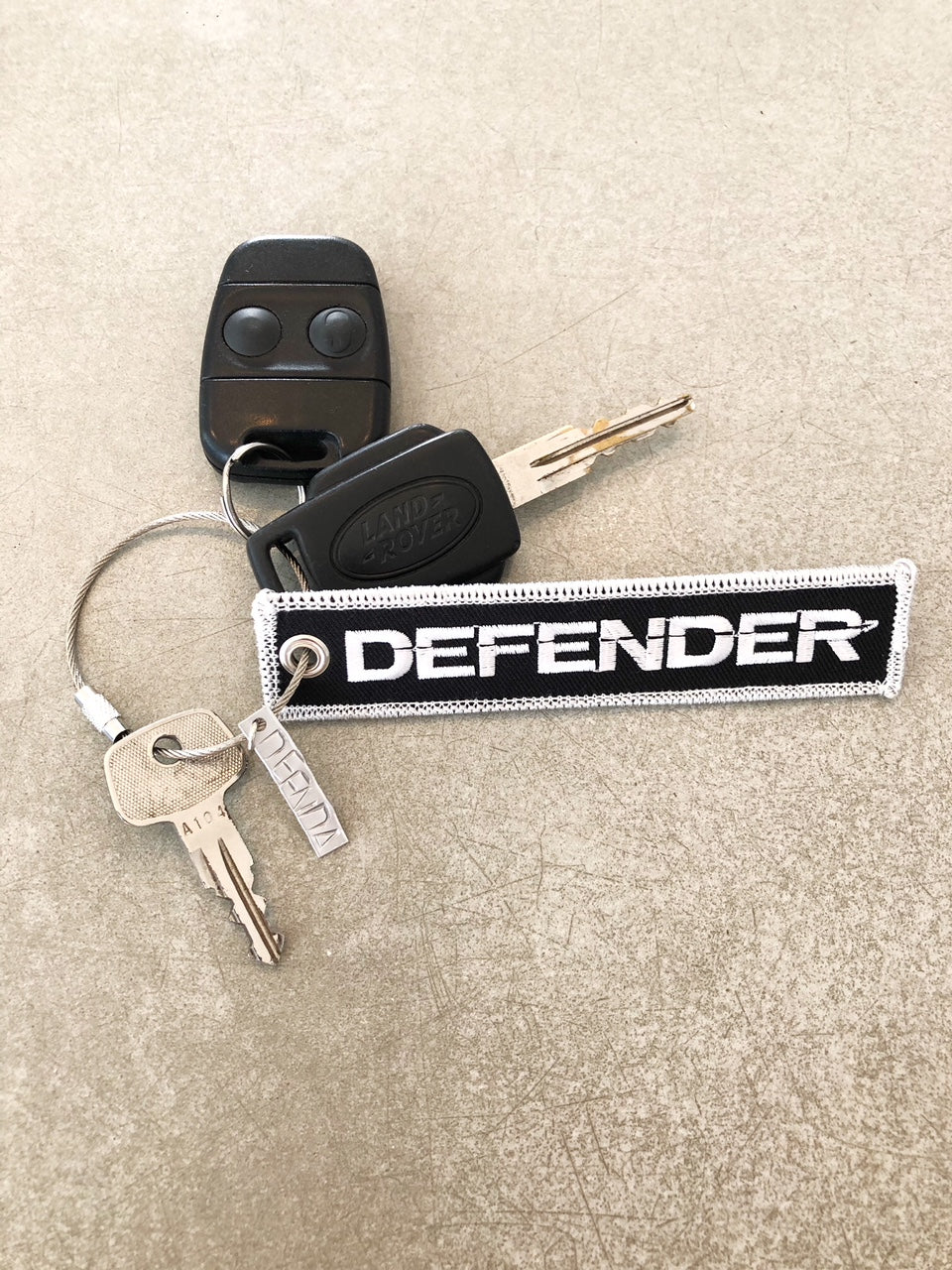 Land Rover DEFENDER Embroidered Key Ring - Blk & Silver