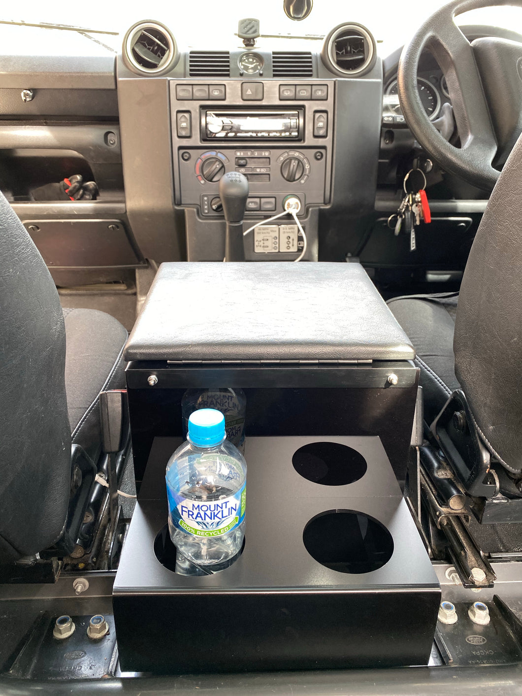 Defender rear mount cubby cup holder